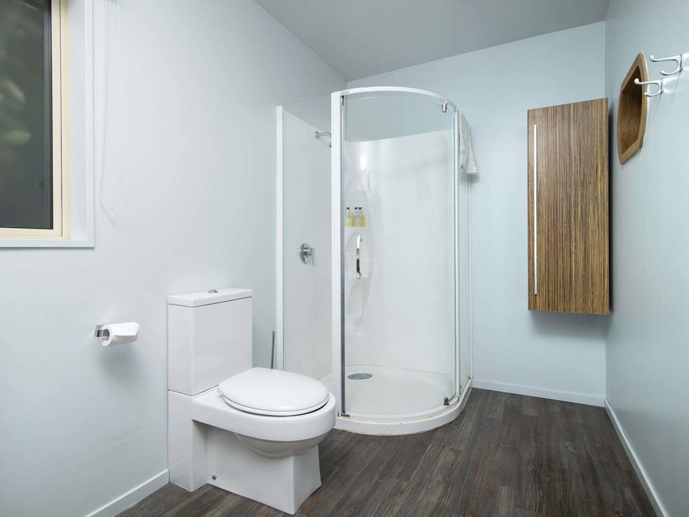 The Frond Suite accommodation room bathrooms each feature a shower at Punga Cove in the Marlborough Sounds in New Zealand's top of the South Island