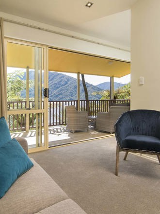 Mamaku Apartment accommodation rooms have a spacious lounge area with sofas and seating and private balcony at Punga Cove in the Marlborough Sounds in New Zealand's top of the South Island