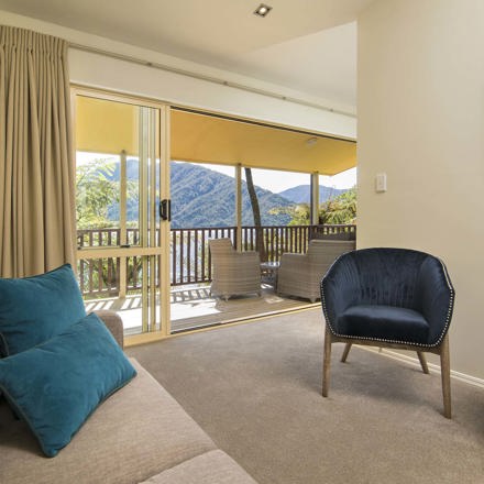 Mamaku Apartment accommodation rooms have a spacious lounge area with sofas and seating and private balcony at Punga Cove in the Marlborough Sounds in New Zealand's top of the South Island