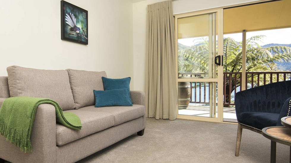 Mamaku Apartment accommodation rooms have a spacious lounge area with sofas and seating and private balcony at Punga Cove in the Marlborough Sounds in New Zealand's top of the South Island