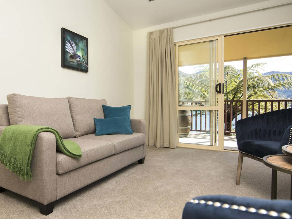 Mamaku Apartment accommodation rooms have a spacious lounge area with sofas and seating and private balcony at Punga Cove in the Marlborough Sounds in New Zealand's top of the South Island