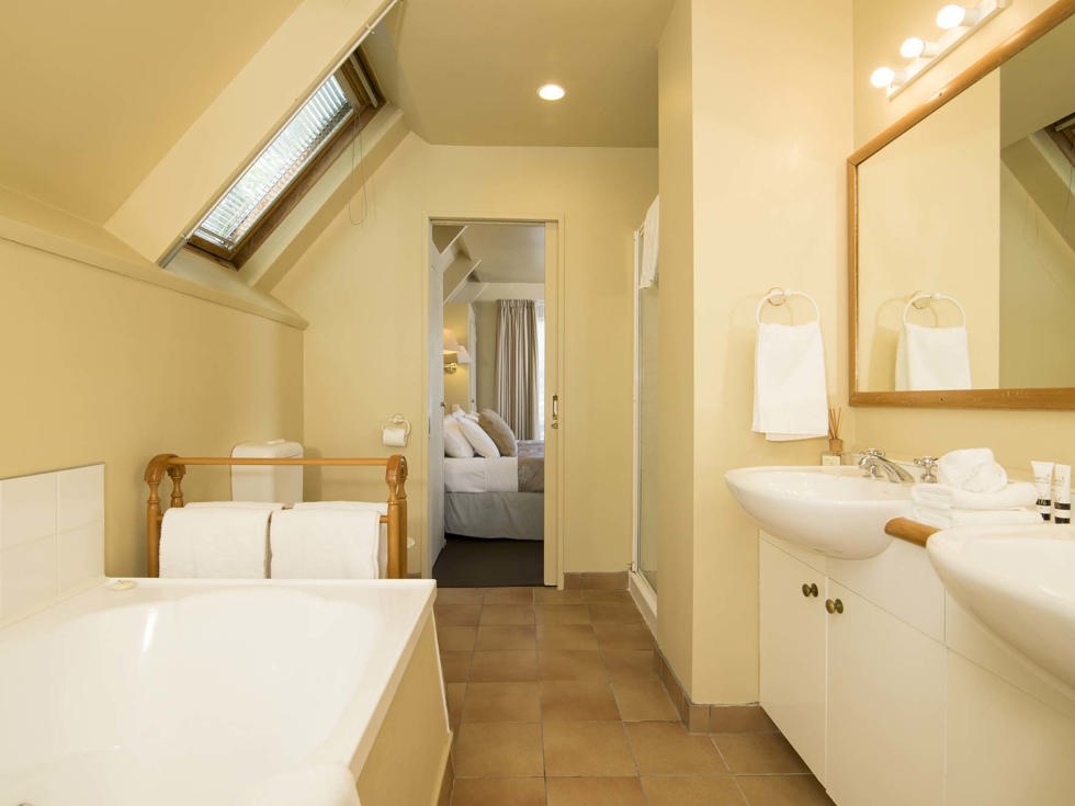 The Mamaku Apartment accommodation room bathrooms feature a shower and some a bath at Punga Cove in the Marlborough Sounds in New Zealand's top of the South Island