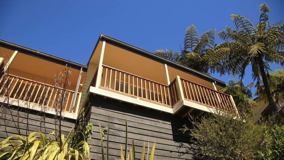 Accommodation room balconies at Punga Cove look out to scenic views of Endeavour Inlet in the Marlborough Sounds in New Zealand's top of the South Island