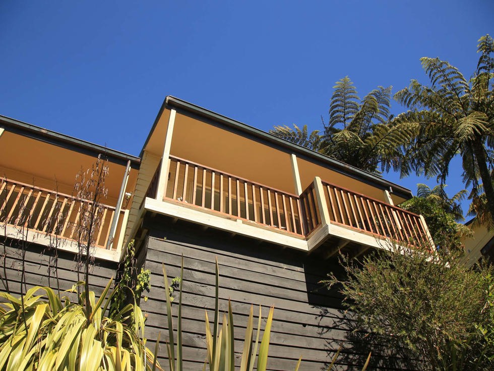 Accommodation room balconies at Punga Cove look out to scenic views of Endeavour Inlet in the Marlborough Sounds in New Zealand's top of the South Island