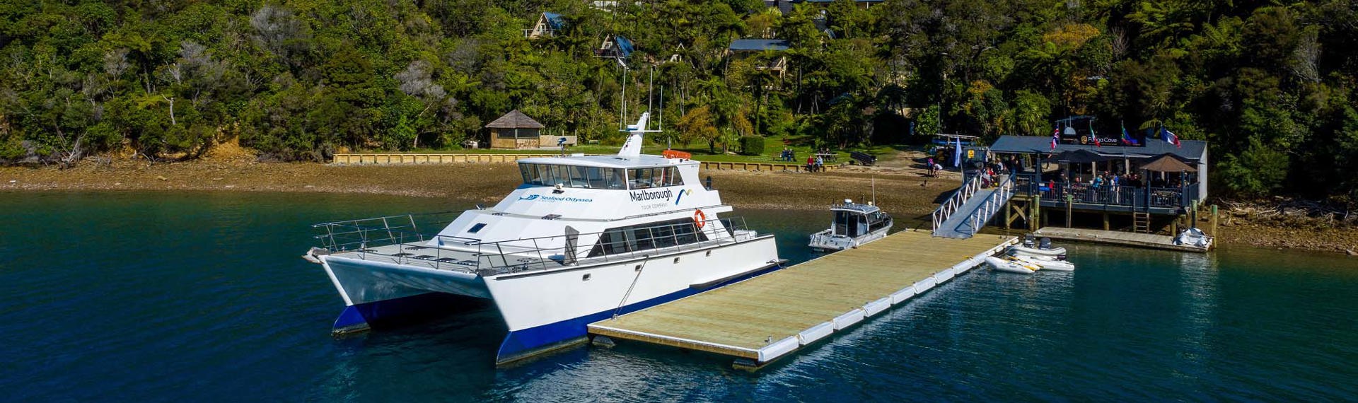 Large commercial vessel can park easily at Punga Cove's jetty located at the bottom of the accommodation property in the Marlborough Sounds in New Zealand's top of the South Island