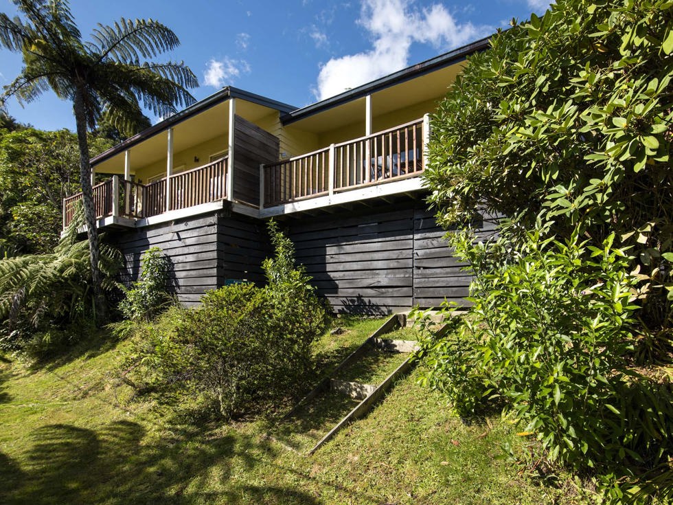 Frond Suite accommodation rooms are surrounded by lush green native bush and have a private balcony at Punga Cove in the Marlborough Sounds in New Zealand's top of the South Island