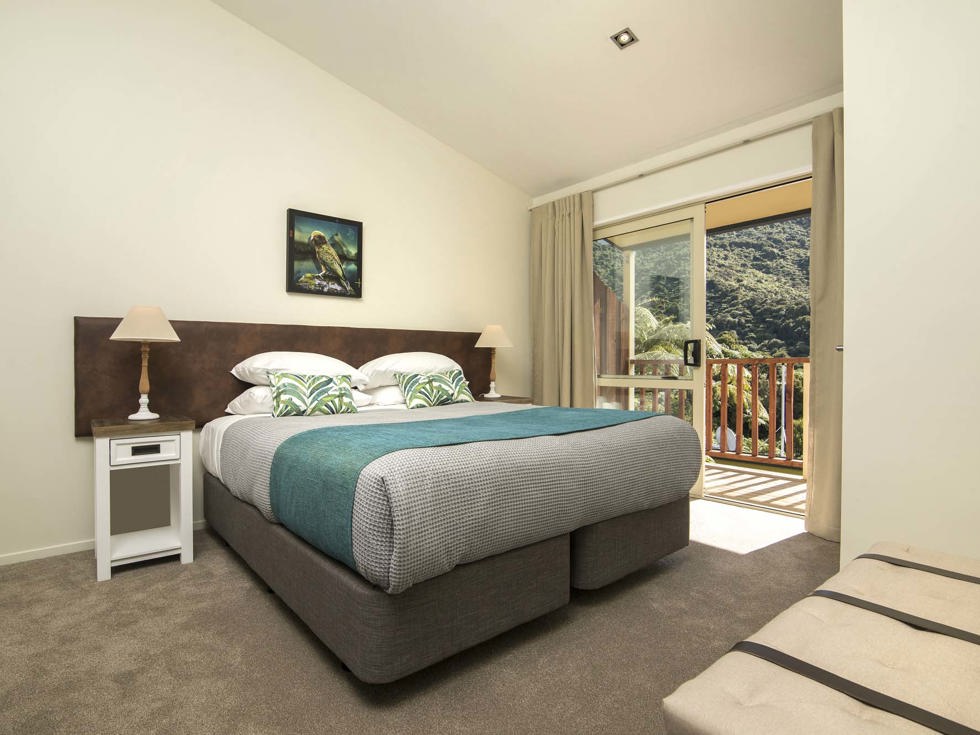 Frond Suites include a spacious bedroom area with a King bed and private balcony for relaxing and enjoying scenic Endeavour Inlet views at Punga Cove in the Marlborough Sounds of New Zealand